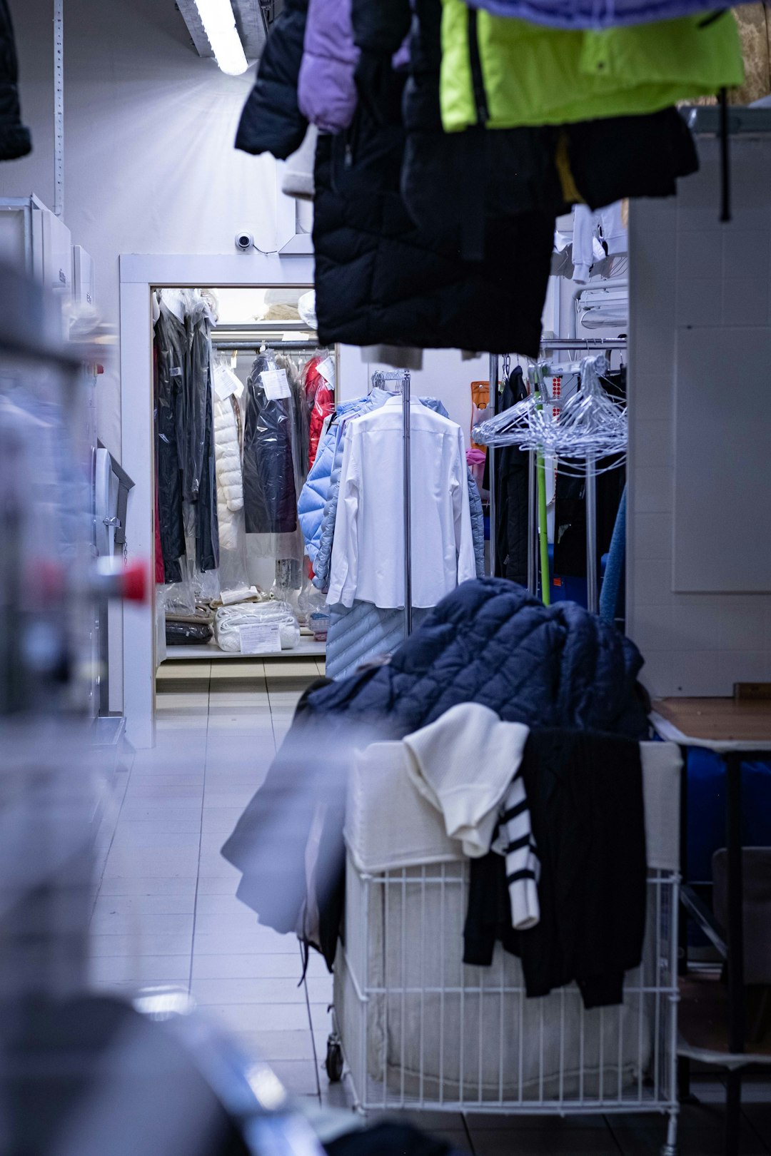 portfolio-06 a-clothing-store-with-clothes-hanging-on-racks-jjfepx0egau